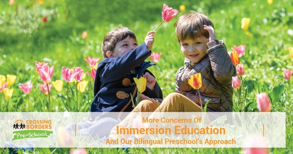 Two joyful boys play in a field of tulips, one playfully offering a flower to the other, capturing a moment of friendship.